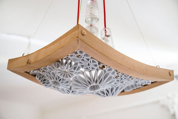 curved wooden frame of this ceiling ligh