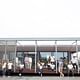 The 2015 Solar Decathlon winning team Stevens Institute of Technology poses with their competition house, the SURE HOUSE. Photo courtesy of Stevens Institute of Technology.