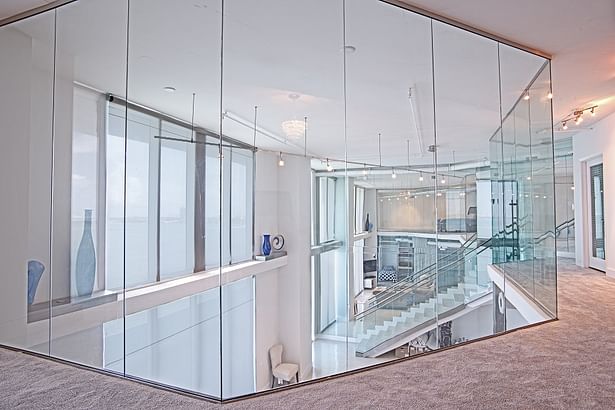 Floor to ceiling glass wall partitions in the new 2nd floor master bedroom