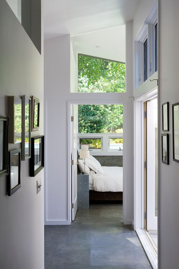 A new master bedroom suite was added to the rear of the home and designed around a new exterior courtyard area that connects to the larger living room patio. 