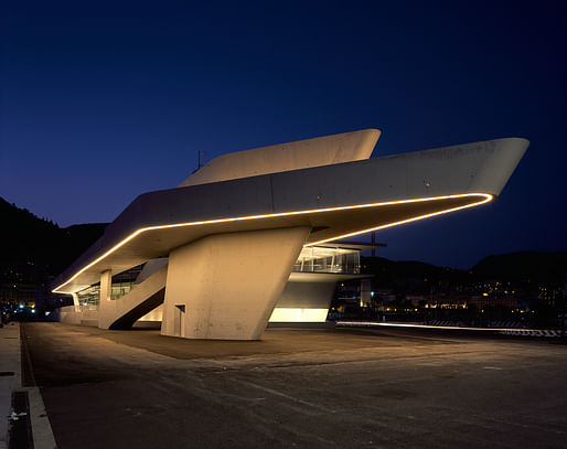 The terminal's exterior at night. Image credit: Helene Binet / courtesy of Zaha Hadid Architects