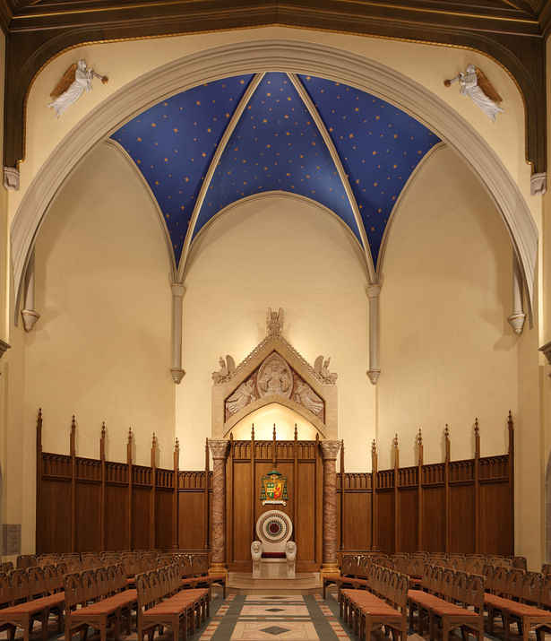 Sactuary Transept features wood-grained plaster wainscot and moldings adorned with marbleized plaster heraldic angels under a starry night sky