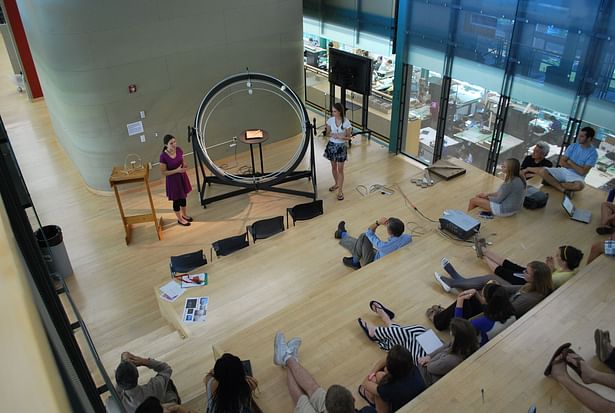 Kara Knechtel (left) and Dominique Doberneck (right) presenting the heliodon to the third year students in the Stuckeman Family Building