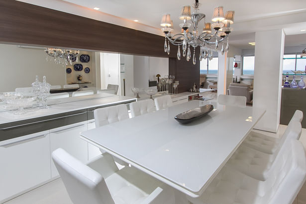 Dining room with cupboard anr mirrored wall at left