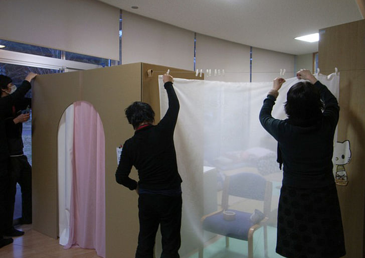 Tanohata Village Temporary Booth designed by Nobukai Furuya with Yoko Ando's curtains (courtesy earthmanual.org). 