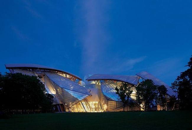 The Fondation Louis Vuitton, which opens to the public in October, lights up the Bois de Boulogne by Hufton and Crow.
