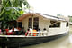 Floating Community Lifeboats: Architect: Mohammed Rezwan (Bangladesh). Implemented by Shidhulai Swanirvar Sangstha on the Atrai, Barnoi, Gurnoi, Nandhakuja, Gumani, and Boral Rivers in Natore, Pabna, and Sirajganj districts, Bangladesh, 2002-present. Sal wood and other woods, plywood, bamboo...