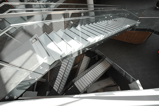 Stairs inside GW's Milken Institute School of Public Health are a central feature of the building, meant to attract visitors to walk up the steps and get more activity. Elevators have a less central location. (Washington Business Journal; Photo: Joanne Lawton)