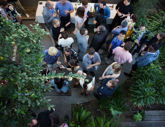 Partiers in the courtyard, as photographed from the second story balcony off the guest bedrooms. Photo by Diana Koenigsberg (www.dianakoenigsberg.com)