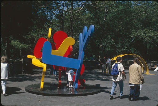 Keith Haring, Yellow Arching Figure, w/ Untitled (Three Dancing Figures), part of Keith Haring on Park Avenue, Doris C. Freedman Plaza, 1997. Photograph by Frederick Charles. Courtesy Public Art Fund, NY