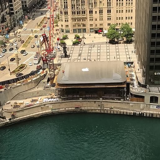 A snap taken just before the construction workers centered the logo on top of the new Chicago Apple Store. Image: @korieeman via Instagram