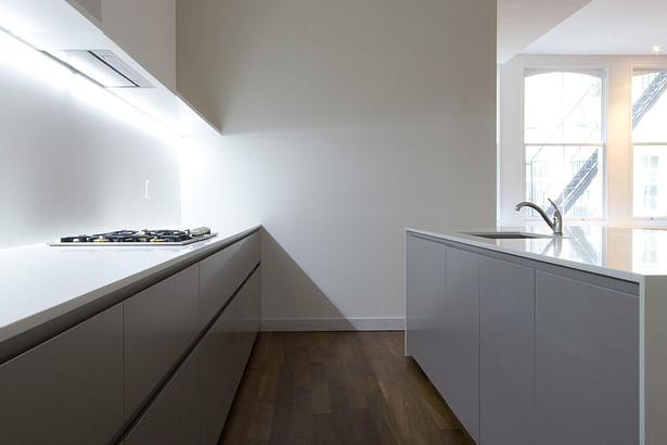 GLAM Kitchen: smooth matte gray Lacquer and CaesarStone quartz countertop.