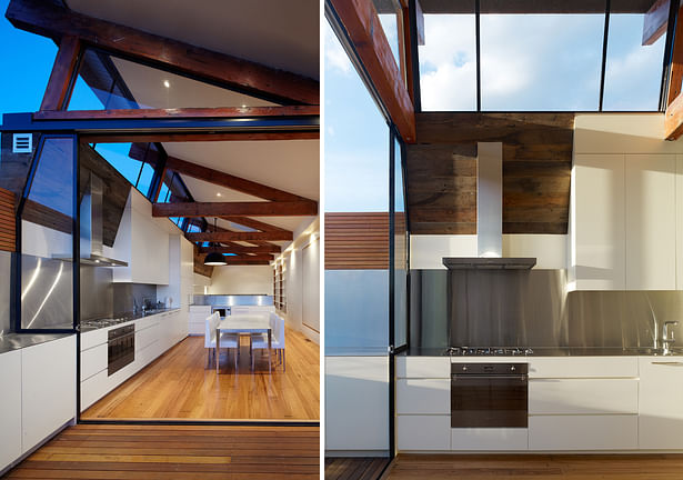 The top living level is completely open plan, with spaces defined by the reclaimed roof trusses - simply raised up from the original roof. Light floods in the living level, via clerestory glazing between the reclaimed trusses. The Kitchen & Dining area connects effortlessly to the rooftop terrace. Photo: Peter Bennets