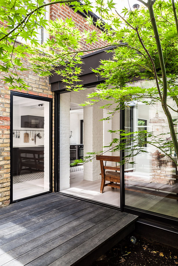 A courtyard connects the new wing to the existing residence