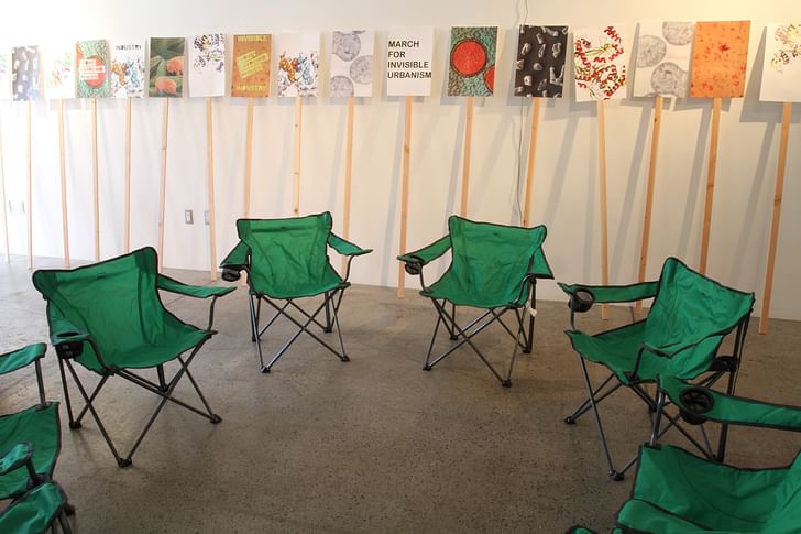 Camp chairs and picket-signs set up for GRNASFCK's exhibition 'I love extremophiles!' Credit: GRNASFCK