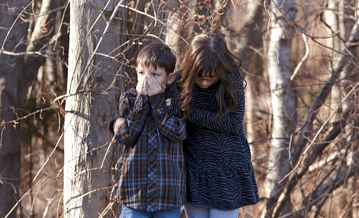 Young children wait outside Sandy Hook Elementary School after a shooting in Newtown, Connecticut, December 14, 2012. A shooter opened fire at the elementary school in Newtown, Connecticut, on Friday, killing dozens including children, the Hartford Courant newspaper reported. REUTERS/Michelle...