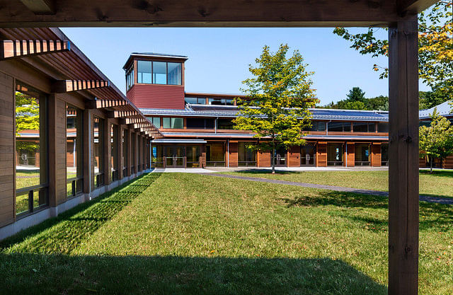 The Kohler Environmental Center as seen from the courtyard at Choate Rosemary Hall in Wallingford, Connecticut. To achieve net-zero energy use the building uses an array of tactics including natural ventilation and controlled use of daylight and shade. Solar panels have been installed on the roof and on an array behind the building. Photographer: Peter Aaron/Robert A. M. Stern Architects via Bloomberg 