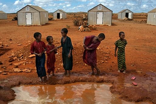  Families in front of 'Better Shelters' at the Hilawyen refugee camp in Dollo Ado, Ethiopia. 