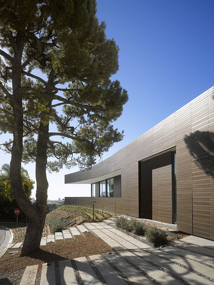 The facade is sheathed in anodized aluminum panels. Image courtesy of SPF:architects