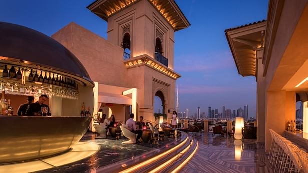 Rooftop club and restaurant looking toward Dubai skyline.