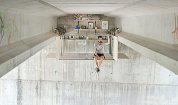 A self-taught designer builds a secret work studio on the underside of a bridge