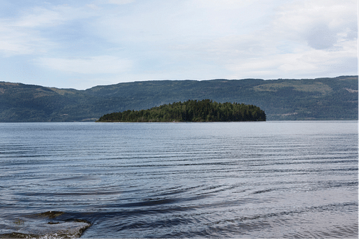 Two memorial sites will be built in Oslo and the island of Utøya, pictured above.