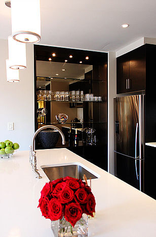Wet bars use stainless steel to contrast the Wenge wood veneer cabinets. 