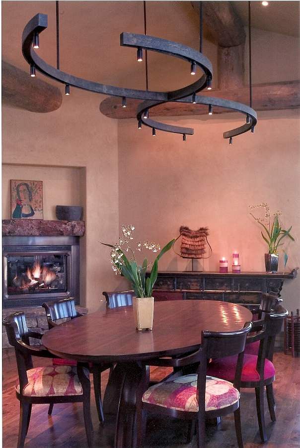 Custom lighting and table with the warmth of american clay for the walls