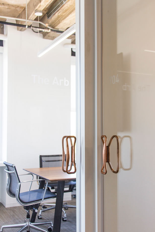 Conference table and door handles fabricated by Synecdoche