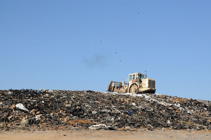 Construction waste fills a landfill. Via: http://tlfearthexchange.wordpress.com/