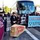 Protestors in front of a tech shuttle bus in San Francisco, 2013. Image via SFGate.