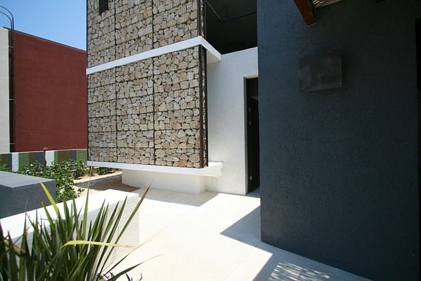 detail of the gabion wall and facade