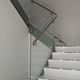 Glass panels were side-mounted along the staircase with a brushed stainless steel standoff anchor system.