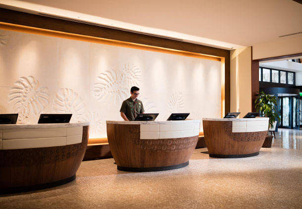 Custom Designed Reception Desks with Carved Stone Wall