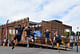 Team members from California Polytechnic State University, San Luis Obispo, kick up their heels during a team cheer at the U.S. Department of Energy Solar Decathlon at the Orange County Great Park, Irvine, California, Monday, Oct. 12, 2015. (Credit: Richard King/U.S. Department of Energy Solar...