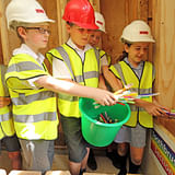Over 700 school children visited the construction site. Students from St. Andrew’s Primary school visited the house to learn about carbon neutral building, and also brought their own old toothbrushes to be used as wall insulation in the house. Photo courtesy of Duncan Baker-Brown.