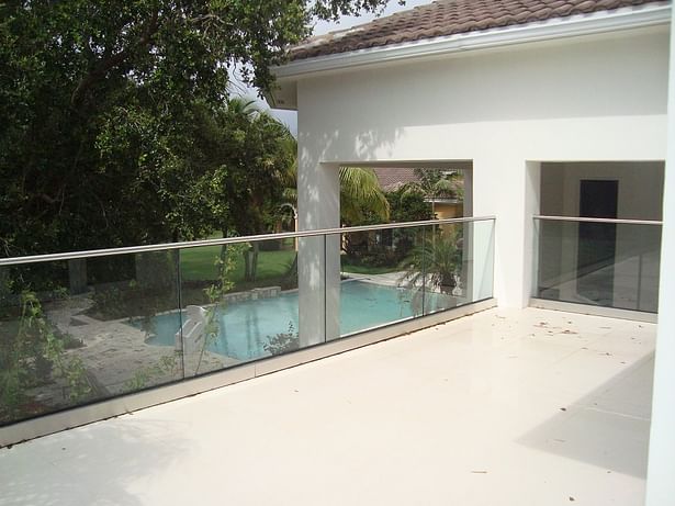 Exterior Balcony: Stainless Steel Cladding & Stainless Steel Cap Rail in a Brushed Finish, 316 Grade.