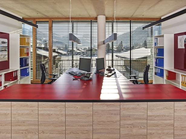 Light offices with peaceful surfaces, hiding large storage space.
