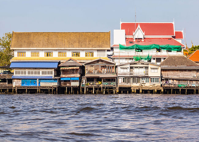 Chao Phraya River, in Bangkok, Thailand. Houses elevated on stilts lie on the Chao Phraya riverside. Photo: Dario Lo Presti