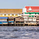 Chao Phraya River, in Bangkok, Thailand. Houses elevated on stilts lie on the Chao Phraya riverside. Photo: Dario Lo Presti