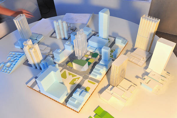 These are some of the site models that Studio Gang was bringing to Lexington for a public meeting on Thursday, June 2, 2011, to show design alternatives for the CentrePointe block. The CentrePointe block is in the middle of the rectangle; the block can be removed and replaced with one of the other blocks on the table. 