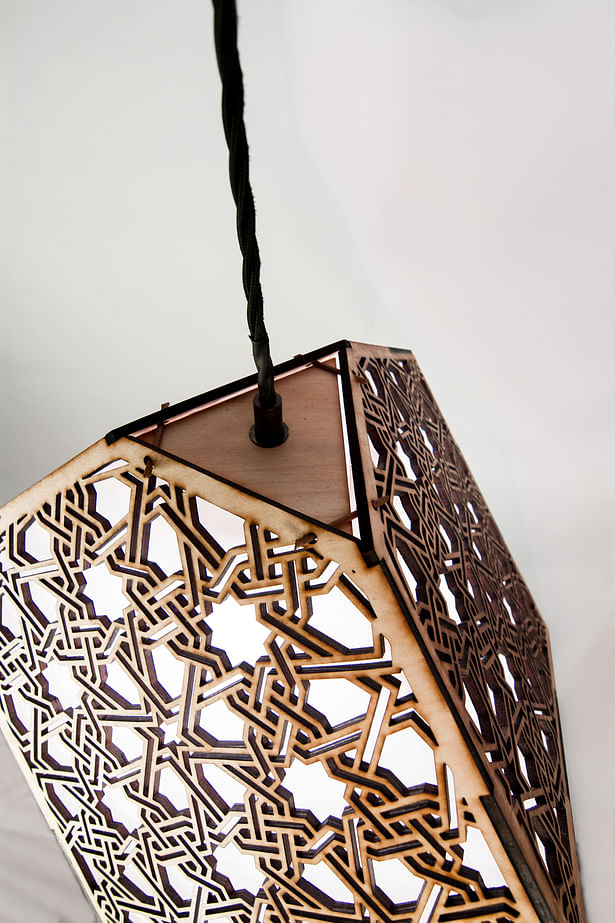 Detail of medium size laser cut pendant lamp by Smith Factory, LLC