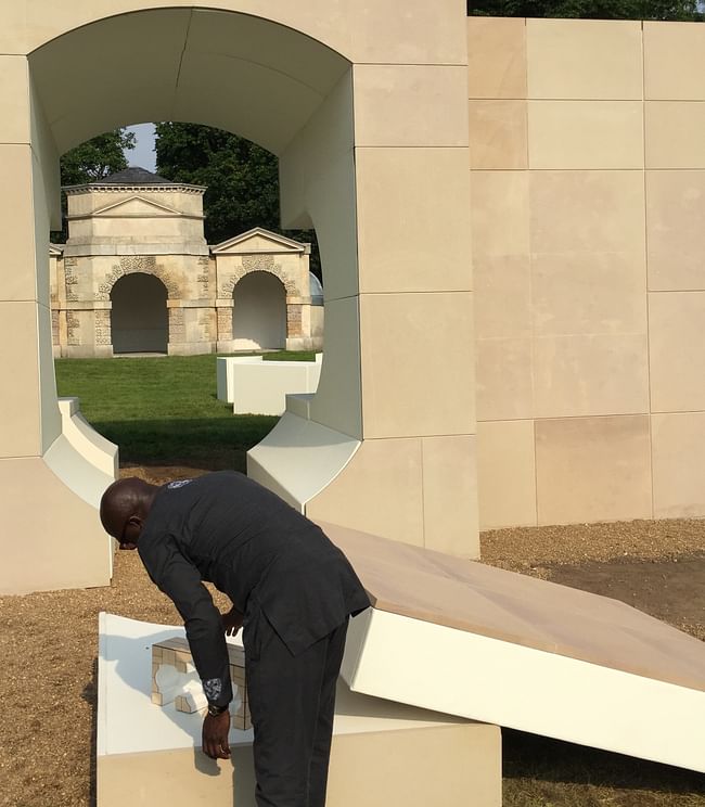 Kunlé Adeyemi with his pavilion, a model of his pavilion, and Queen Caroline's Temple in the background. Image credit: Robert Urquhart