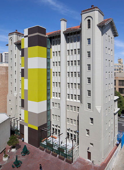 New elevator tower butresses building against earthquakes.