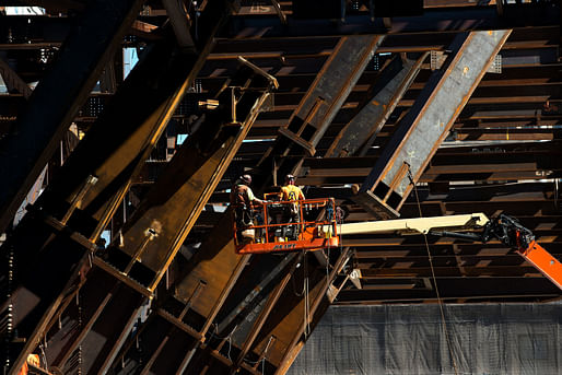 Workers install braces to connect the tower’s pedestal to the core. Credit Bryan Thomas for The New York Times