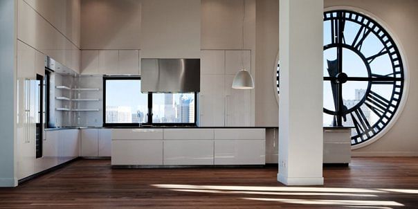 GLAM Kitchen: white lacquer with 45-degree edged and black melamine interiors and stainless steel drawers.