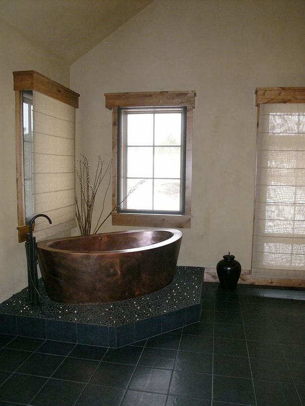 Copper master tub with fiber optic lighting in the stone