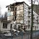 A half-demolished 'Khrushchyovka' apartment block in Moscow with new development behind. Image: Wikipedia.