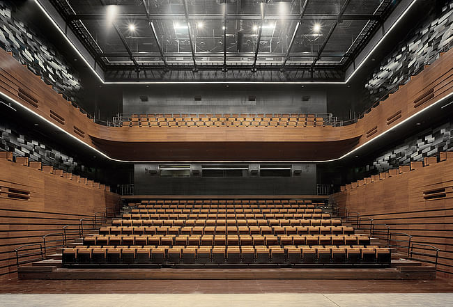 The small auditorium as seen from stage. The 700 seats are partly retractable to enable a multifunctional usage of the space. (Photo: Jussi Tiainen)