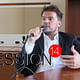 Photo of Bjarke Ingels chatting with Paul and Amelia at the National Building Museum